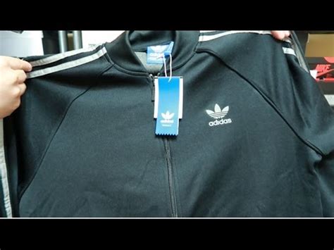 fake adidas jacket|adidas counterfeit products.